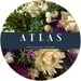 blue Atlas logo surrounded by photos of flowers in a white circle frame